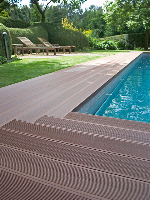 Worker applying balcony coating with roller